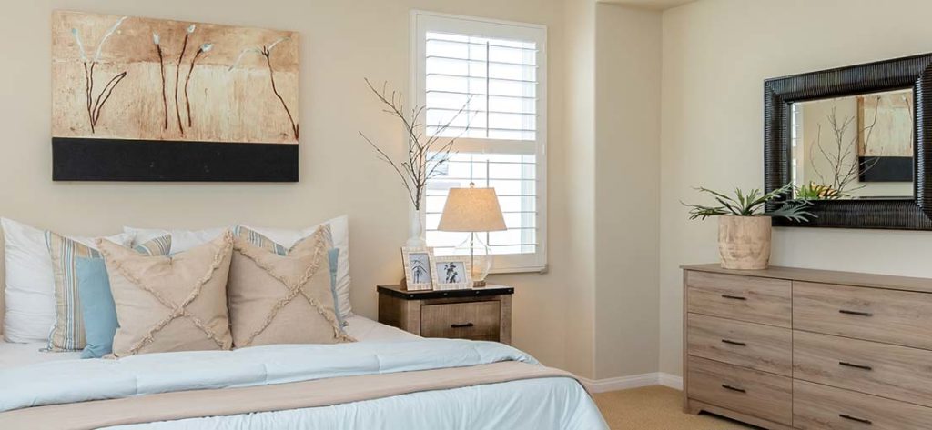 Timeless design meets modern technology: White motorized blackout blinds in a Stevenson Ranch home.