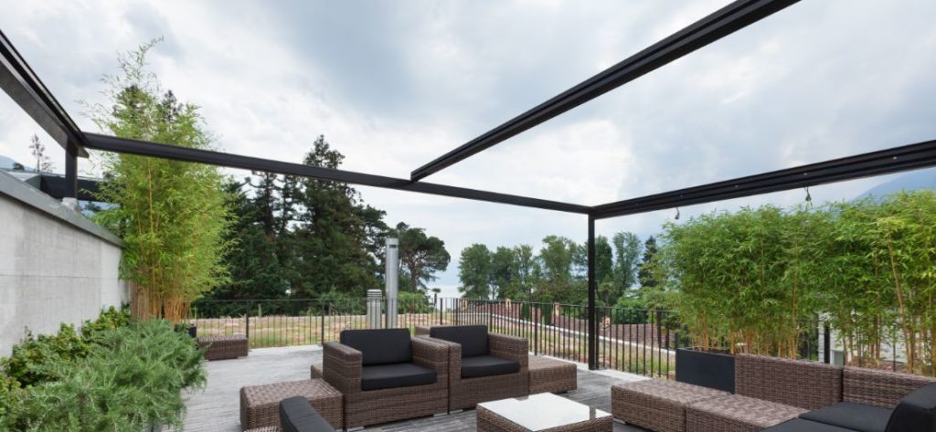 Relax and entertain in style on this El Segundo patio deck featuring Wi-Fi motorized shades.