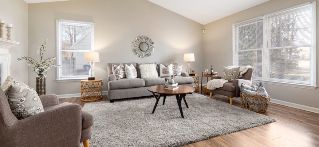 Living room in a Carson home transformed with motorized window blinds.