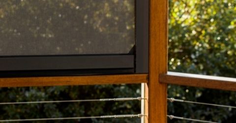 Detailed image of fabric panels used for sun shading on a pergola.