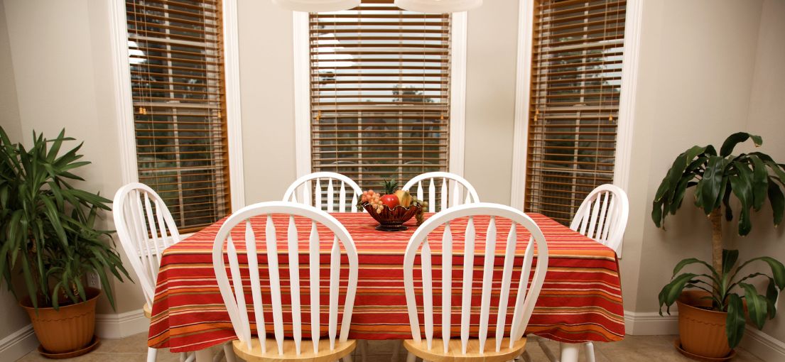 A view on a classic wooden blinds in a dining room