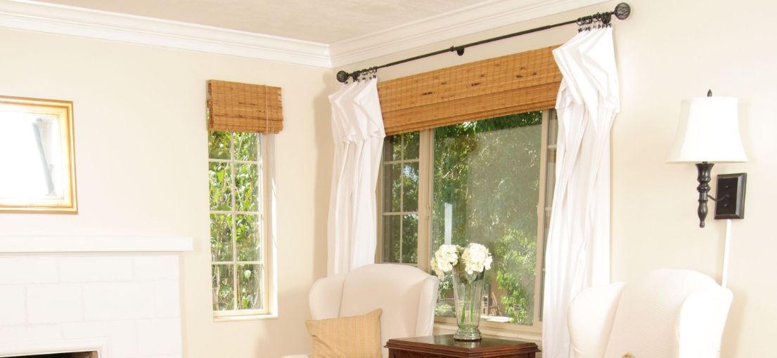 A view at a cozy bright living room with bamboo window shades