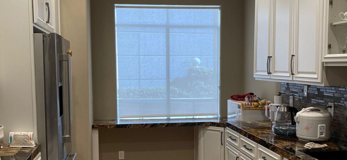 Custom window treatment by Master Blinds adding sophistication to an Encino kitchen.