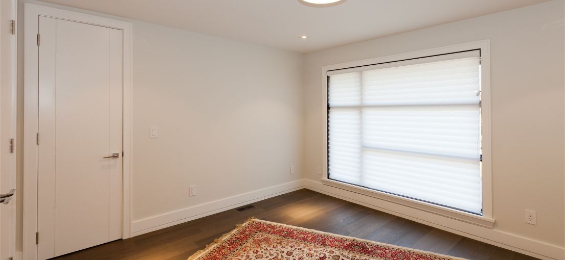 A Burbank home’s living room with elegant room darkening vinyl blinds installed by Master Blinds.