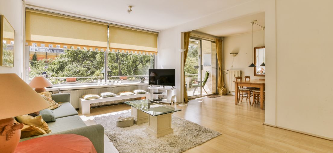 Woodland Hills living room featuring custom yellow roller shades.