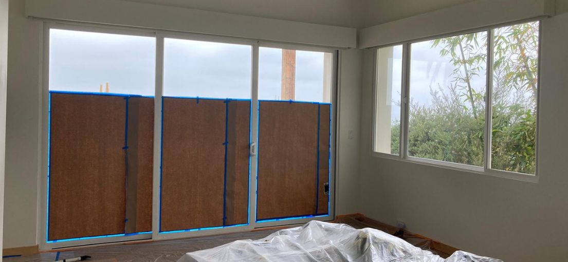 Motorized roller shades being installed in a Thousand Oaks home, demonstrating the expertise of Master Blinds in delivering cutting-edge window treatments.