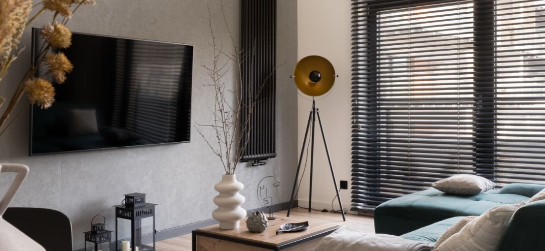 Contemporary West Hollywood living room featuring chic aluminum mini blinds for optimal light control.