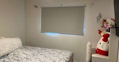 Child's bedroom in Chatsworth with white blackout roller shades installed by Master Blinds.