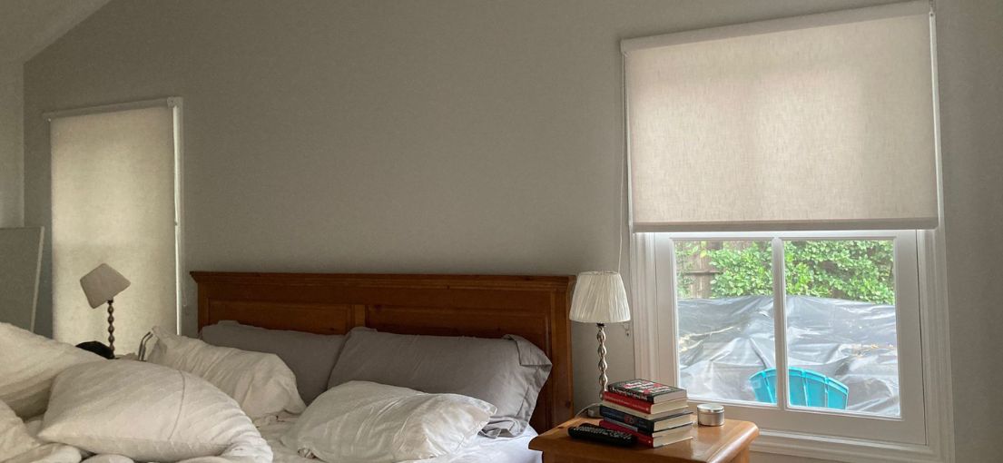 Sheer roller shades installed in an Agoura Hills bedroom with soft natural light filtering through.