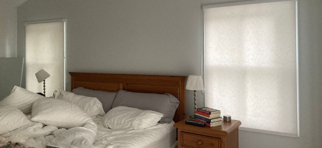 Sheer roller shades installed in an Agoura Hills bedroom with soft natural light filtering through.