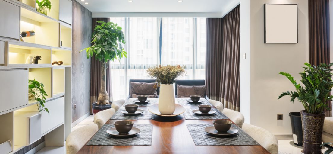 Contemporary dining area showcasing elegant curtain and drape combination