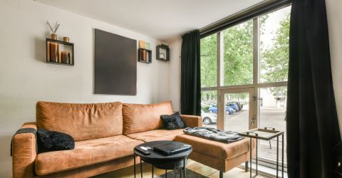 Stylish black drapes installed in a Woodland Hills apartment living room for modern elegance.