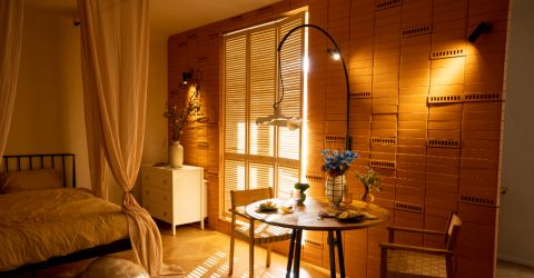 Elegant dining area featuring custom window shutters installed in a Malibu apartment.