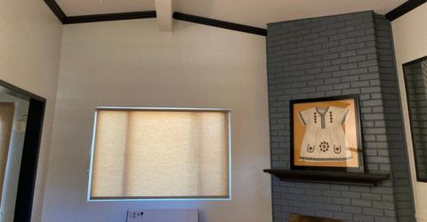 Bedroom in Marina Del Rey featuring custom beige roller shades installed by Master Blinds.